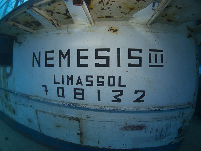 Nemesis III name painted on the side of the wreck