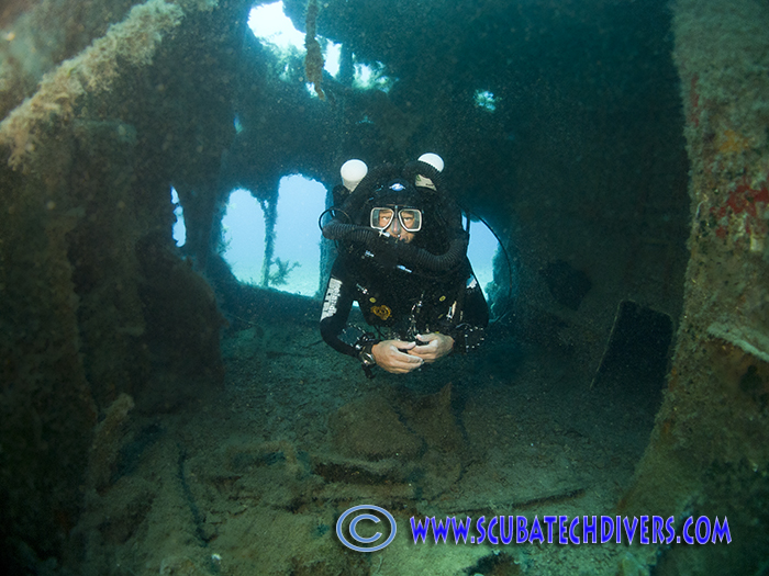 diver descending on the wreck of the cricket