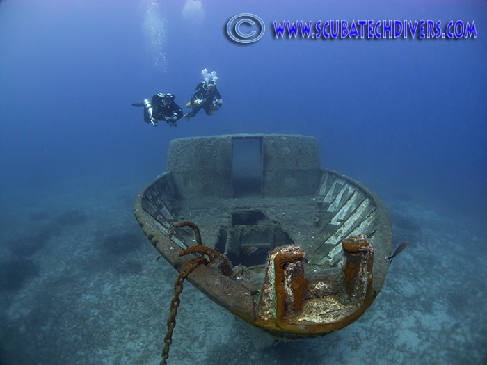 Technical Divers swim over the top of the Liberty wreck in Protaras