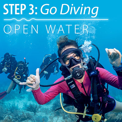 SDI Open water Diver in the water giving an ok sign