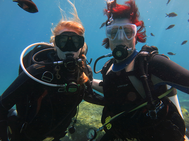 SDI instructor poses with her student underwater on the SDI Discovery DIve in cyprus