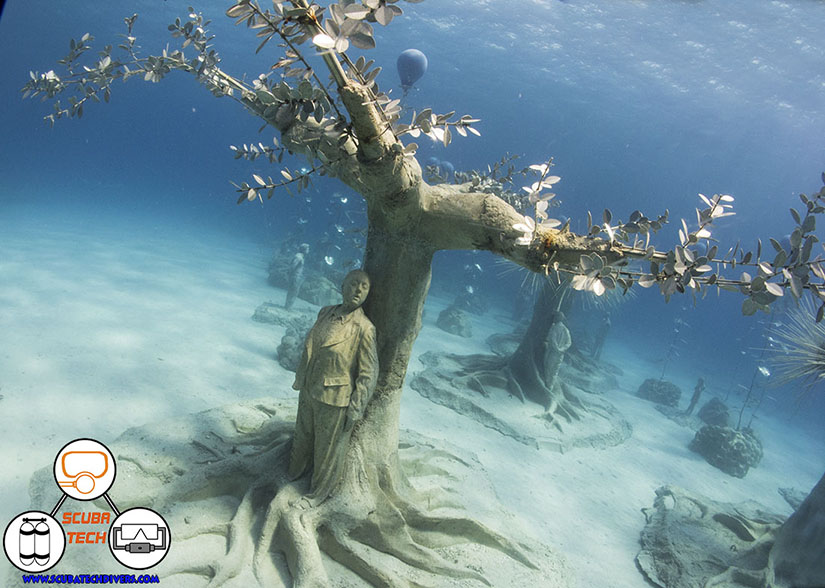 sculture of a woman hides amongst the trees in the underwater forest of Ayia Napa