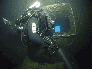 Diver on Megalodon rebreather inside zenobia wreck in Cyprus