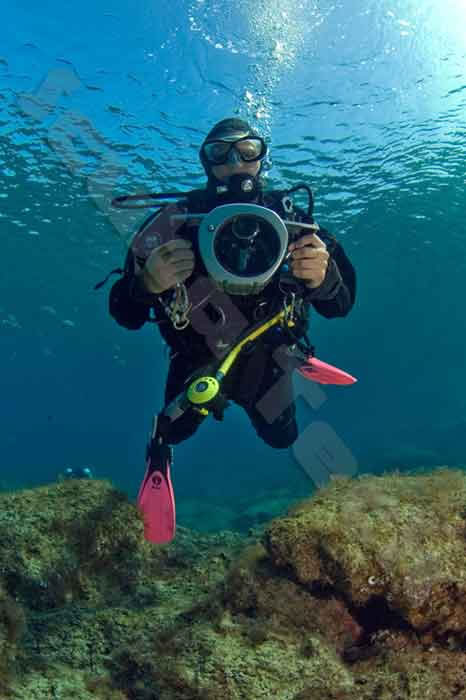 diver filming the dives at green bay
