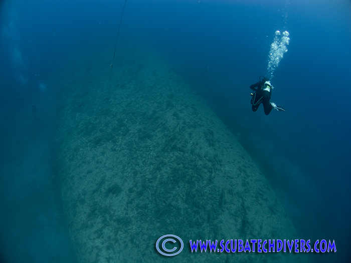 diver descending on the wreck of the cricket
